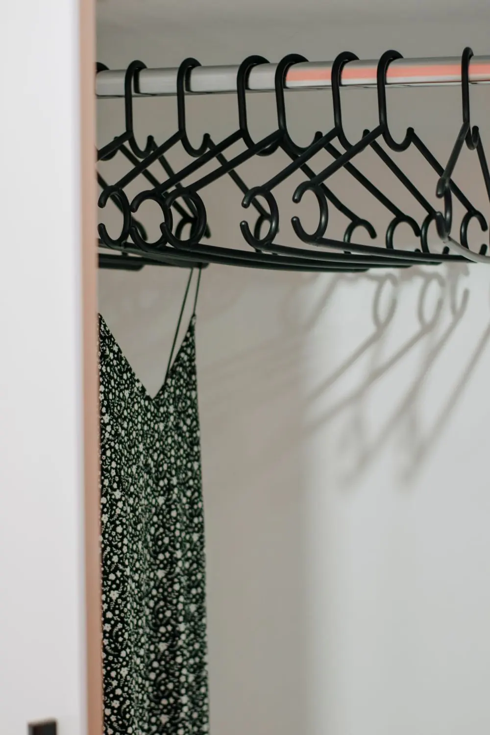 Reference photo 2: long dress hanging in a wardrobe — abayas & kaftans we manufacture and export in bulk to Qatar