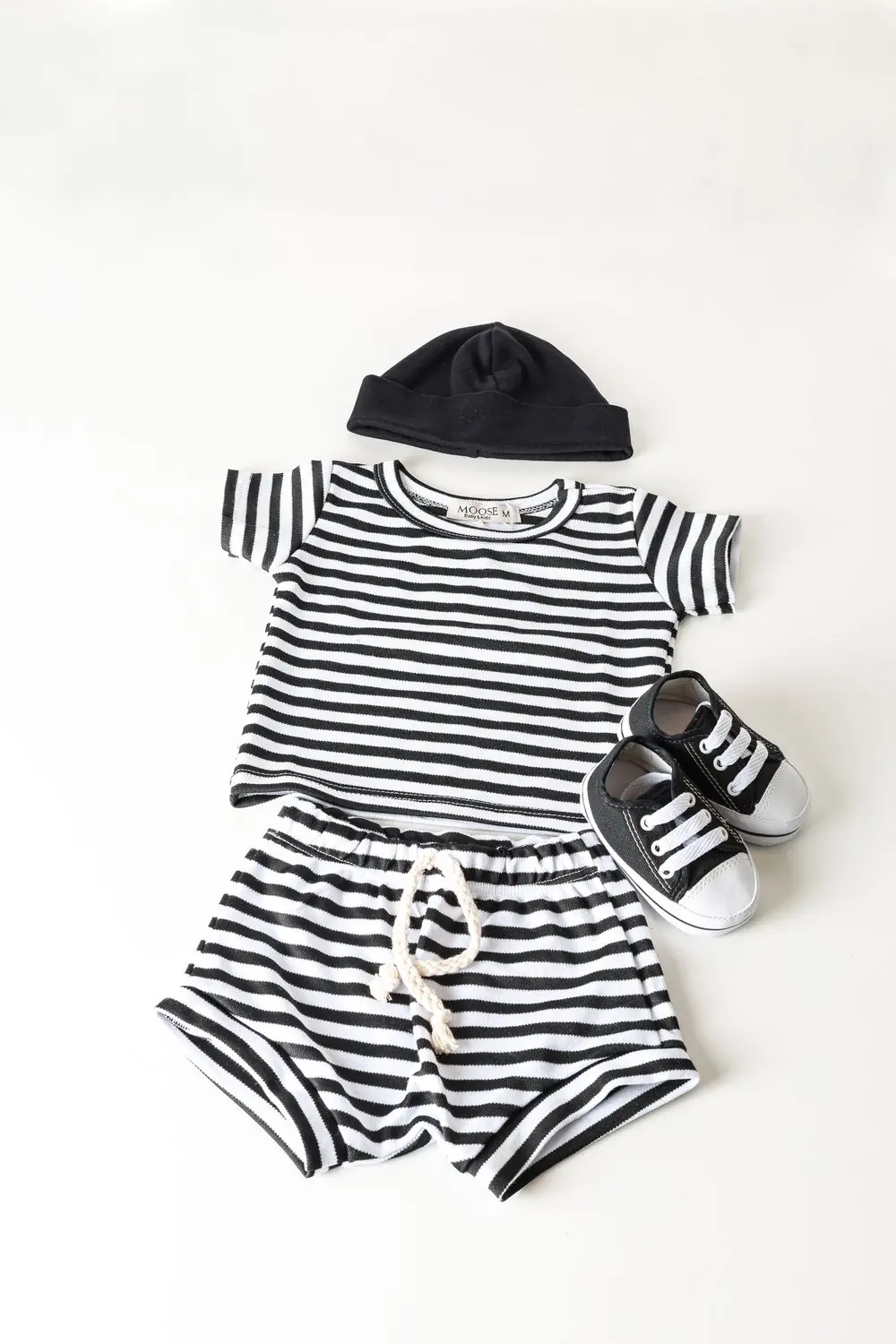 Reference photo 3: striped children's outfit laid flat — kidswear we manufacture and export in bulk to Accra, Ghana
