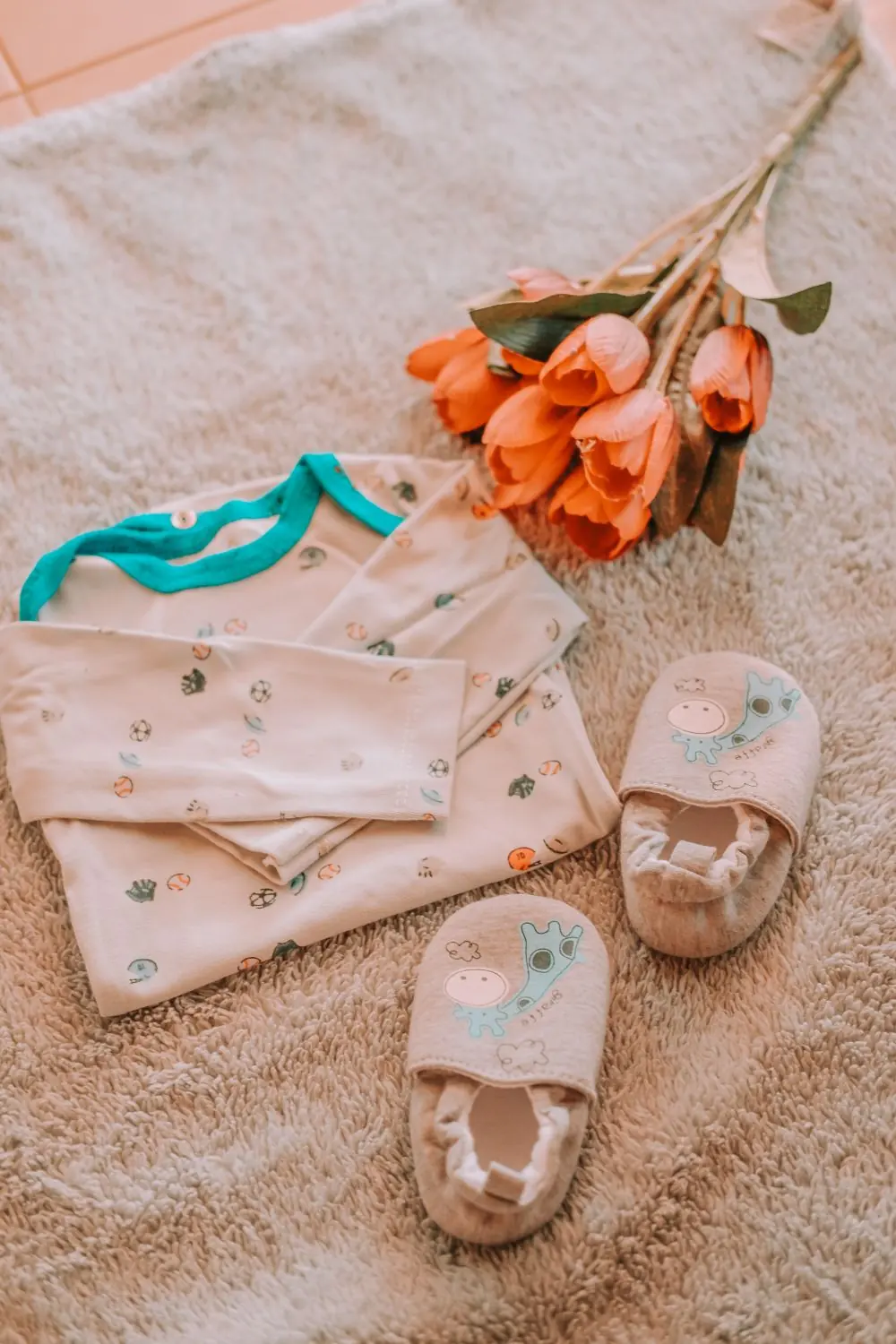 Reference photo 4: baby clothes laid flat — kidswear we manufacture and export in bulk to Accra, Ghana