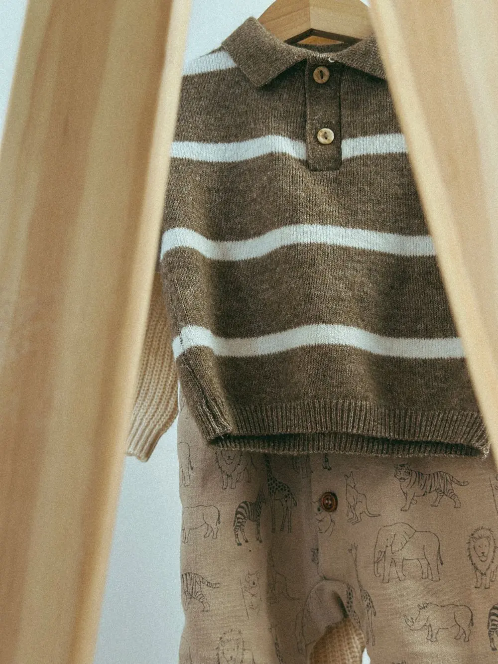 Reference photo 5: knitted children's top on a hanger — kidswear we manufacture and export in bulk to Accra, Ghana