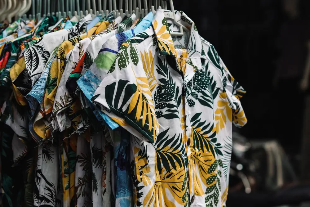 Reference photo 2: tropical print shirts on a display rack — printed shirts we manufacture and export in bulk to Qatar