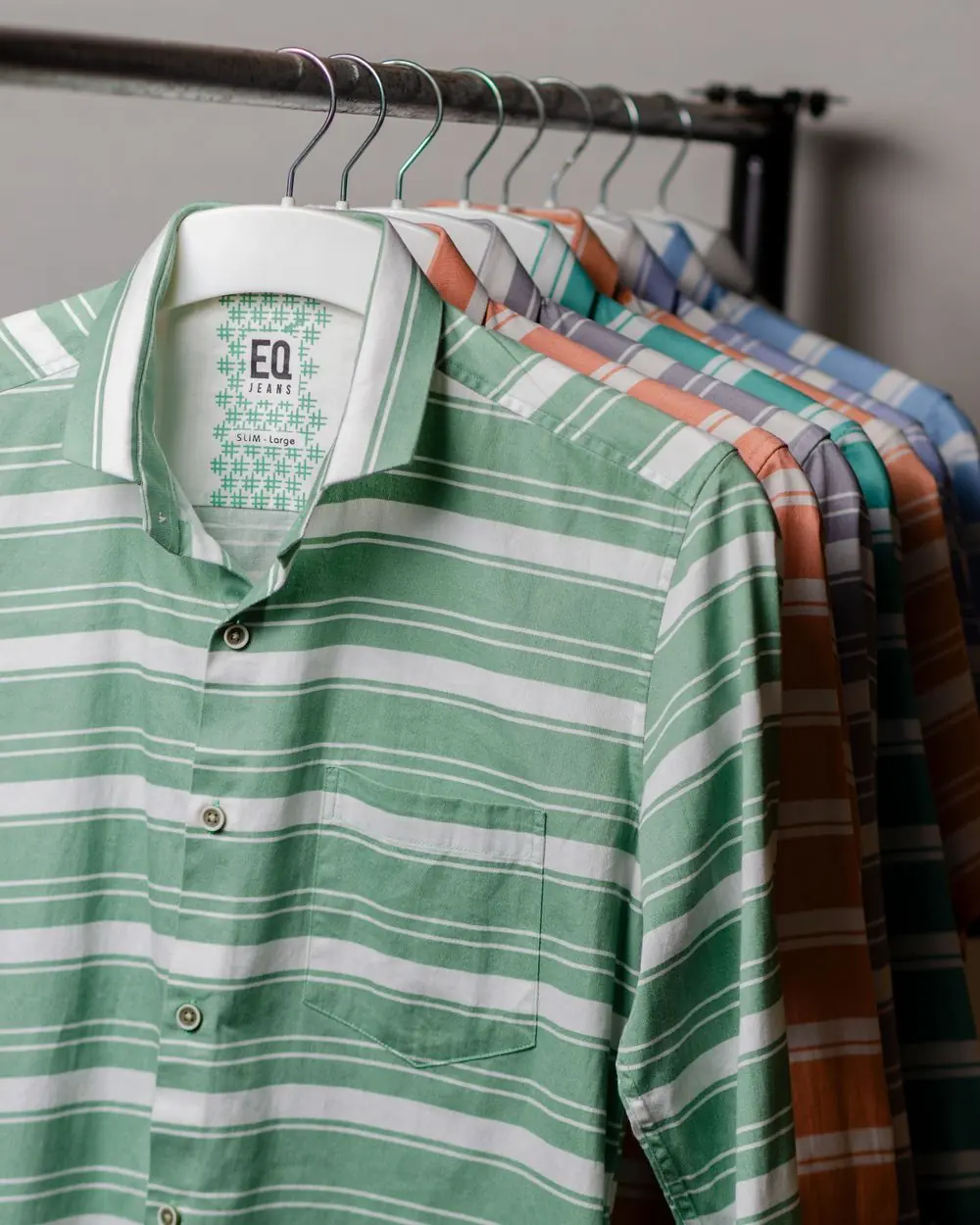 Reference photo 5: green striped shirt on a hanger — shirts we manufacture and export in bulk