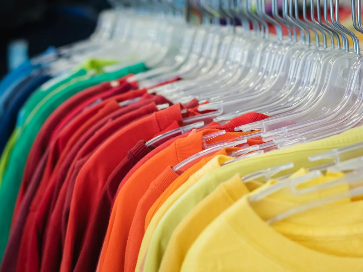 T-Shirts: colourful cotton T-shirts on a rail — reference photo from our export range